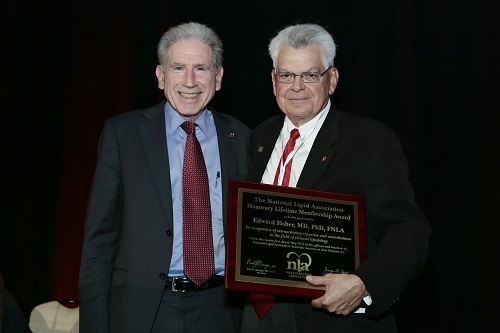 Edward Fisher receives award presented by James Falko